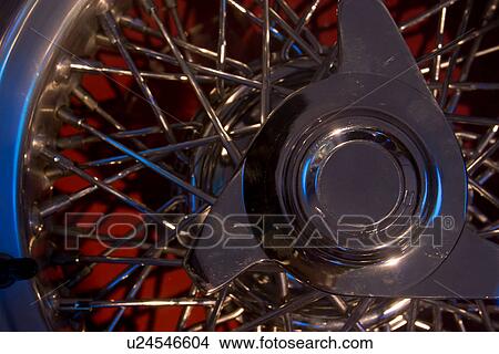 Detail of chrome wire spoked wheel with knock-off hub View Large Photo Image Picture - Detail of chrome wire spoked wheel with knock-off hub. Fotosearch