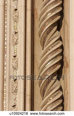 Stock Photo - Detail of ornate stone sculptured pattern around central doorway of Orvieto Duomo. Fotosearch