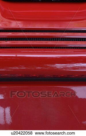 Detail of parked red Ferrari, rear view, on cloudy rainy day View Large Photo Image Stock Photo - Detail of parked red Ferrari, rear view, on cloudy rainy day. Fotosearch