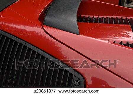 Detail of parked red Ferrari, side view from above View Large Photo Image Stock Photo - Detail of parked red Ferrari, side view from above. Fotosearch