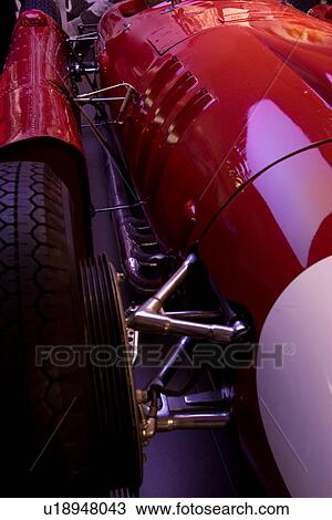 Detail of red Ferrari, race car, front side view, showing wheel and struts View Large Photo Image Stock Image - Detail of red Ferrari, race car, front side view, showing wheel and struts . Fotosearch