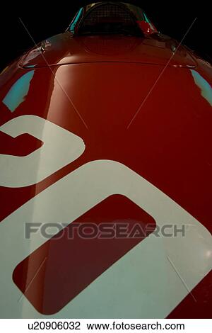 Detail of red Ferrari, race car, front view of hood and cockpit, with number 20 on hood View Large Photo Image Stock Image - Detail of red Ferrari, race car, front view of hood and cockpit, with number 20 on hood. Fotosearch