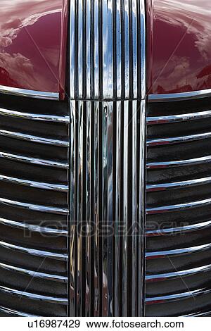 Detail of red hood with silver grille and detail View Large Photo Image Stock Photo - Detail of red hood with silver grille and detail. Fotosearch
