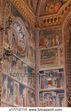 Picture - Detail of side of apse showing wall completely painted with frescoes, illuminated balcony and ornamental wrought iron lamps. Fotosearch
