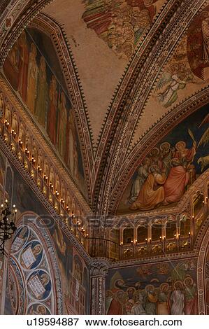 Detail of side of apse showing wall completely painted with frescoes, illuminated balcony, ornamental wrought iron lamps, and barrel vaulted ceiling View Large Photo Image Stock Photo - Detail of side of apse showing wall completely painted with frescoes, illuminated balcony, ornamental wrought iron lamps, and barrel vaulted ceiling. Fotosearch