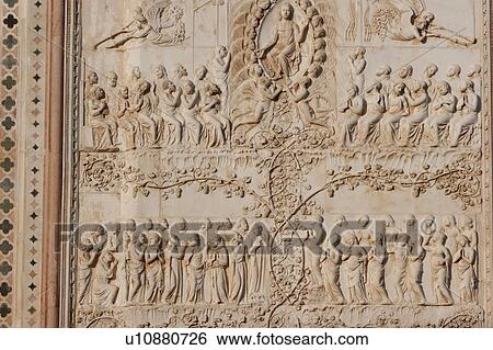 Stock Photograph - detail of stone sculptured bas-relief stone sculptured plaque, showing Last Judgement, on exterior facade of Orvieto Duomo, Umbria, Italy. Fotosearch