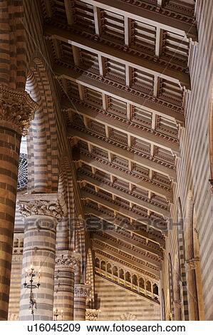Detail view of side nave of Orvieto Duomo, showing black and white striped columns, arches, wooden sloped ceiling View Large Photo Image Stock Photo - Detail view of side nave of Orvieto Duomo, showing black and white striped columns, arches, wooden sloped ceiling. Fotosearch
