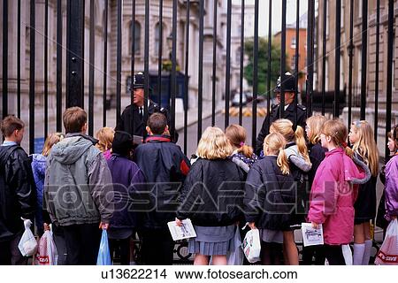 Downing Street, children at iron railing with London Bobbies View Large Photo Image Picture - Downing Street, children at iron railing with London Bobbies. Fotosearch