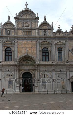 Facade of Scuola San Marco, with person crossing piazza View Large Photo Image Picture - Facade of Scuola San Marco, with person crossing piazza. Fotosearch