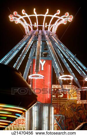 Fairground carousel wheels at night, illuminated, in motion, Gatineau, Quebec, Canada View Large Photo Image Stock Photograph - Fairground carousel wheels at night, illuminated, in motion, Gatineau, Quebec, Canada. Fotosearch