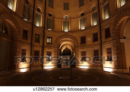 Ferrara Theatre inner courtyard, illuminated circular building, with circulat pattern on ground View Large Photo Image Stock Photo - Ferrara Theatre inner courtyard, illuminated circular building, with circulat pattern on ground. Fotosearch