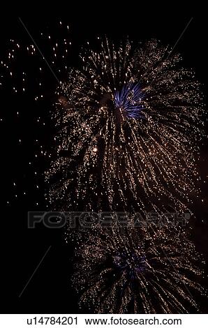 Fireworks exploding in the black night sky View Large Photo Image Stock Image - Fireworks exploding in the black night sky. Fotosearch