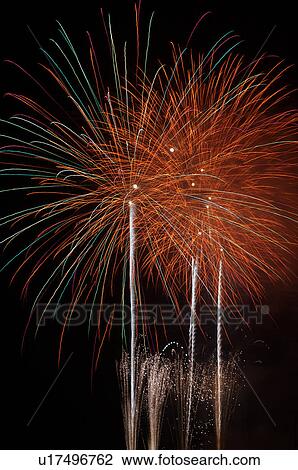 Fireworks exploding in the black night sky View Large Photo Image Stock Image - Fireworks exploding in the black night sky. Fotosearch