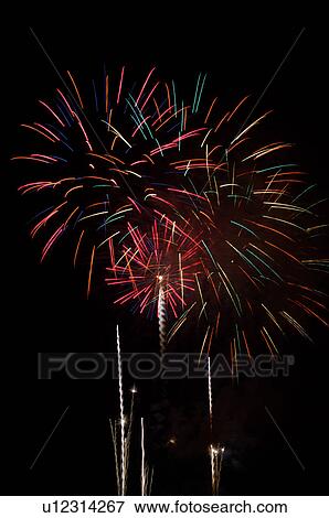 Fireworks exploding in the black night sky View Large Photo Image Stock Photo - Fireworks exploding in the black night sky. Fotosearch