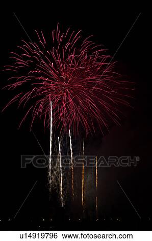 Fireworks exploding in the black night sky View Large Photo Image Stock Photograph - Fireworks exploding in the black night sky. Fotosearch
