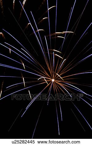 Stock Photography - Fireworks exploding in the black night sky. Fotosearch