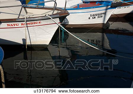 Fishing boats moored in harbour View Large Photo Image Picture - Fishing boats moored in harbour. Fotosearch