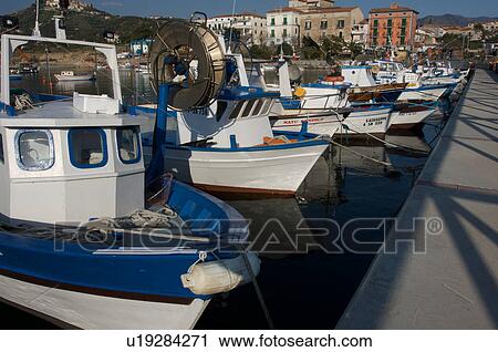 Stock Image - Fishing boats moored in harbour. Fotosearch