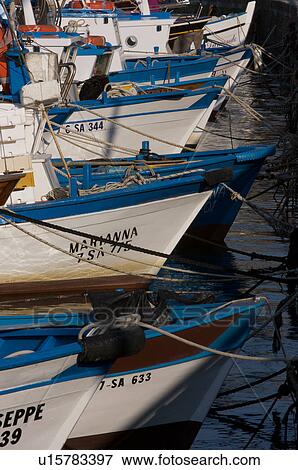 Fishing boats moored in harbour View Large Photo Image Stock Photo - Fishing boats moored in harbour. Fotosearch