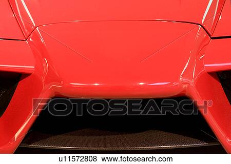 Front detail of new red Ferrari sports car, showing air intake grille View Large Photo Image Stock Photo - Front detail of new red Ferrari sports car, showing air intake grille. Fotosearch