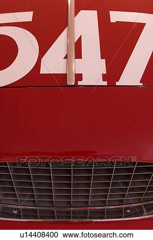 Stock Image - Front detail of red Ferrari race car, aerial view of hood, with numbers 547 displayed. Fotosearch