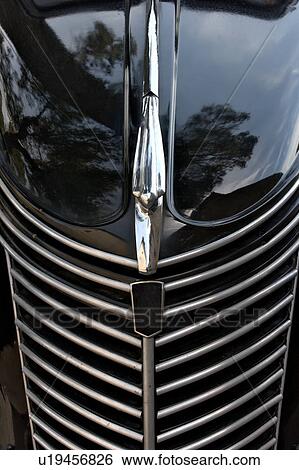 Stock Photograph - Front view detail from above of black Fiat showing hood, headlamps, and grille. Fotosearch