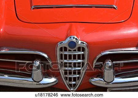 Front view detail of red Alfa Romeo showing hood, bumper and grille View Large Photo Image Stock Photograph - Front view detail of red Alfa Romeo showing hood, bumper and grille. Fotosearch