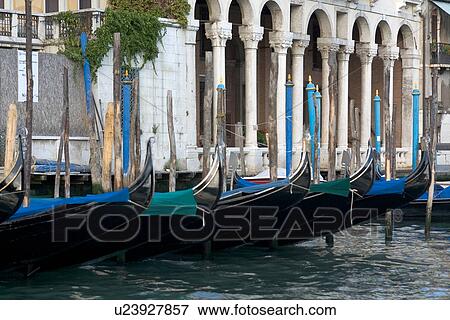 Gondolas moored in Grand Canal, with palazzo in background View Large Photo Image Stock Photo - Gondolas moored in Grand Canal, with palazzo in background. Fotosearch