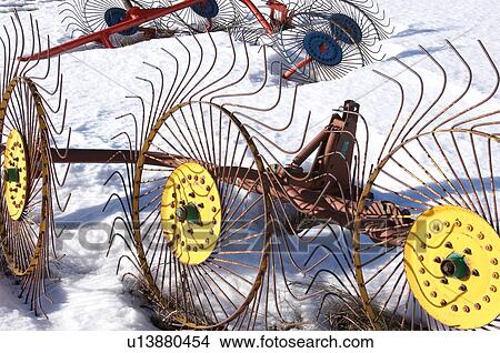 Picture - hay making tools left in the snow over the winter, in meadow of Piano Grande, Umbria, . Fotosearch