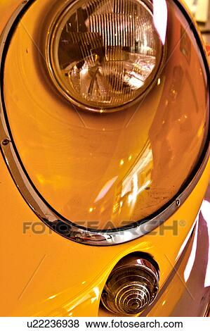 headlight and turning light detail of yellow Ferrari vintage model, with reflection of showroom View Large Photo Image Stock Photo - headlight and turning light detail of yellow Ferrari vintage model, with reflection of showroom. Fotosearch