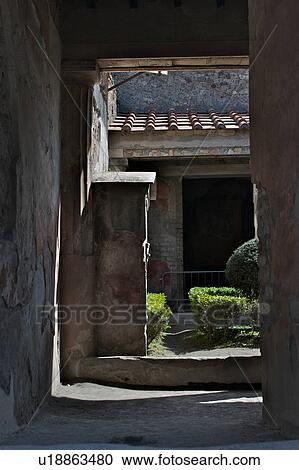 Stock Image - House of Tragic Poet showing peristyle garden and lararium (shrine to household gods). Fotosearch
