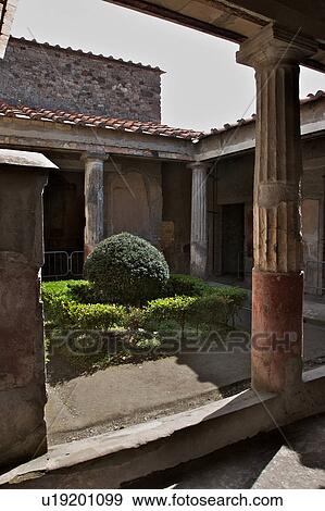 Stock Photo - House of Tragic Poet showing peristyle garden and lararium (shrine to household gods). Fotosearch