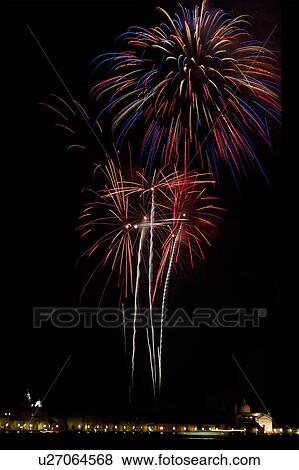 Stock Photo - Il Redentore Fireworks over Giudecca with church of San Zattere and Santissima Redentore,, Venice: Fireworks exploding in the black night sky. Fotosearch
