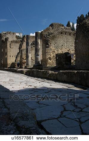 In the shadow of Vesuvius, the ruins of Ercolano - view of street with houses View Large Photo Image Stock Image - In the shadow of Vesuvius, the ruins of Ercolano - view of street with houses. Fotosearch