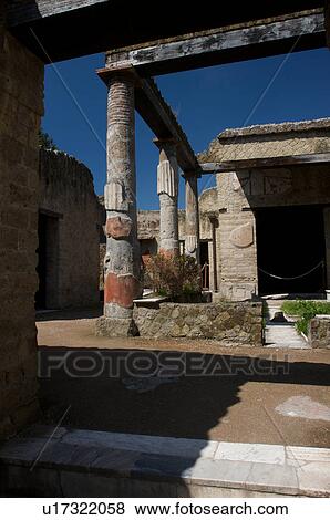 Stock Photo - In the shadow of Vesuvius, the ruins of Ercolano - House of the Corinthian Atrium. Fotosearch