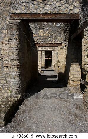 In the shadow of Vesuvius, the ruins of Ercolano - house of the wooden partition, view of peristyle View Large Photo Image Stock Photo - In the shadow of Vesuvius, the ruins of Ercolano - house of the wooden partition, view of peristyle. Fotosearch