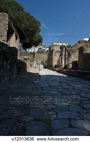 In the shadow of Vesuvius, the ruins of Ercolano - view of street with houses View Large Photo Image Stock Photograph - In the shadow of Vesuvius, the ruins of Ercolano - view of street with houses. Fotosearch