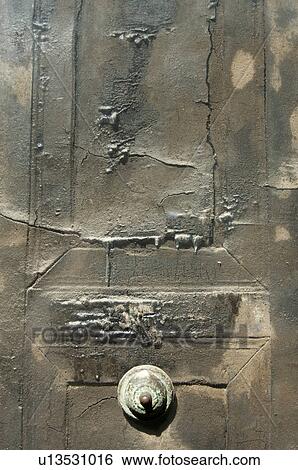 Stock Photograph - In the shadow of Vesuvius, the ruins of Ercolano - detail of house interior with detail of carbonised wooden door. Fotosearch