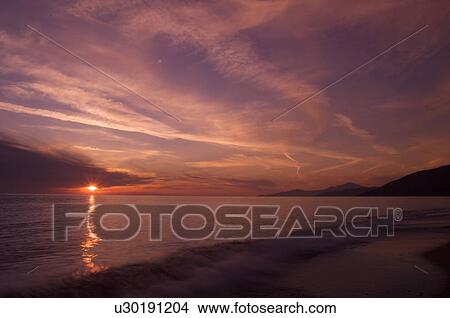 Italian beach at sunset, with motion blur of waves View Large Photo Image Picture - Italian beach at sunset, with motion blur of waves. Fotosearch