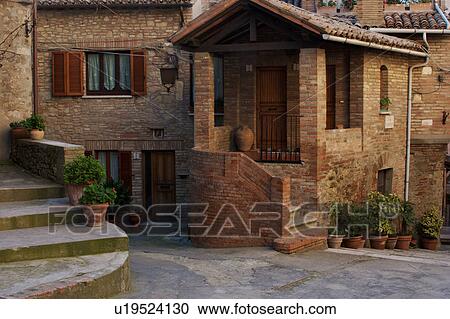 Italian village -view of medieval houses renovated surrounding empty piazza in hilltop village View Large Photo Image Stock Image - Italian village -view of medieval houses renovated surrounding empty piazza in hilltop village. Fotosearch