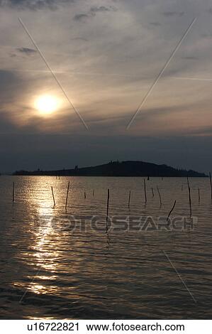 Lake Trasimeno view of island at sunset View Large Photo Image Stock Image - Lake Trasimeno view of island at sunset. Fotosearch