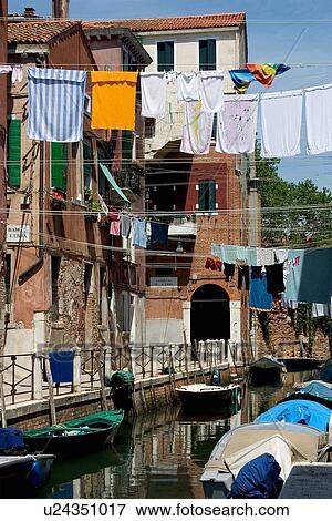 Stock Photo - laundry day, washing hanging over the canal. Fotosearch