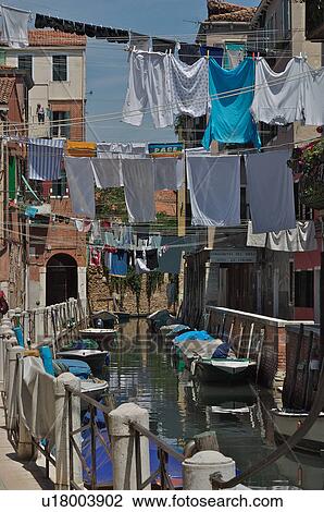 Laundry hanging over canal on sunny day in Burano View Large Photo Image Stock Image - Laundry hanging over canal on sunny day in Burano. Fotosearch
