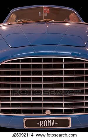 Low front detail of blue Ferrari antique car, view of hood, windscreen and front grille View Large Photo Image Picture - Low front detail of blue Ferrari antique car, view of hood, windscreen and front grille. Fotosearch