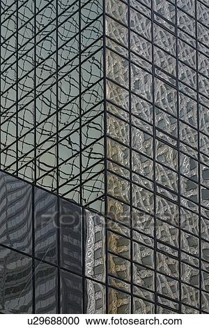 Stock Image - Mobil Building reflected in glass windows. Fotosearch