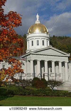 Stock Photo - Montpelier State legislature in Fall sunlight with red maple tree in foreground. Fotosearch