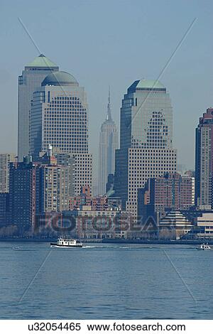 New York Skyline with view of Empire State Building, from Ellis Island ferry View Large Photo Image Stock Photography - New York Skyline with view of Empire State Building, from Ellis Island ferry. Fotosearch