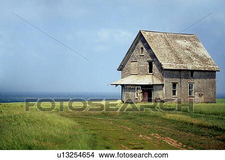 Old farm building on grassy cliff overlooking sea View Large Photo Image Picture - Old farm building on grassy cliff overlooking sea. Fotosearch