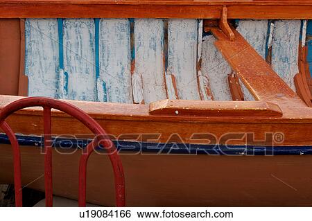Painted orange and blue wooden fishing boat detail at Vietri sul Mare, South Italy View Large Photo Image Stock Photograph - Painted orange and blue wooden fishing boat detail at Vietri sul Mare, South Italy. Fotosearch