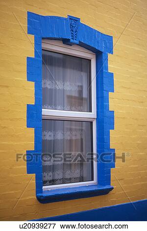 Painted yellow fisherman's house, detail of window with blue frame, Appledore, Devon, England View Large Photo Image Stock Photo - Painted yellow fisherman's house, detail of window with blue frame, Appledore, Devon, England. Fotosearch